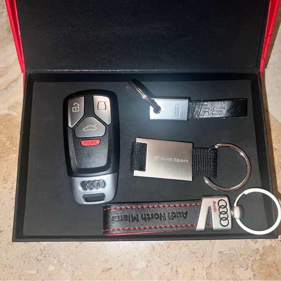 1 AUDI KEYFOB,3 KEY CHAINS, 1 Audi RED BOX, 1 Audi BOOKLET WALLET - Picture 13 of 14